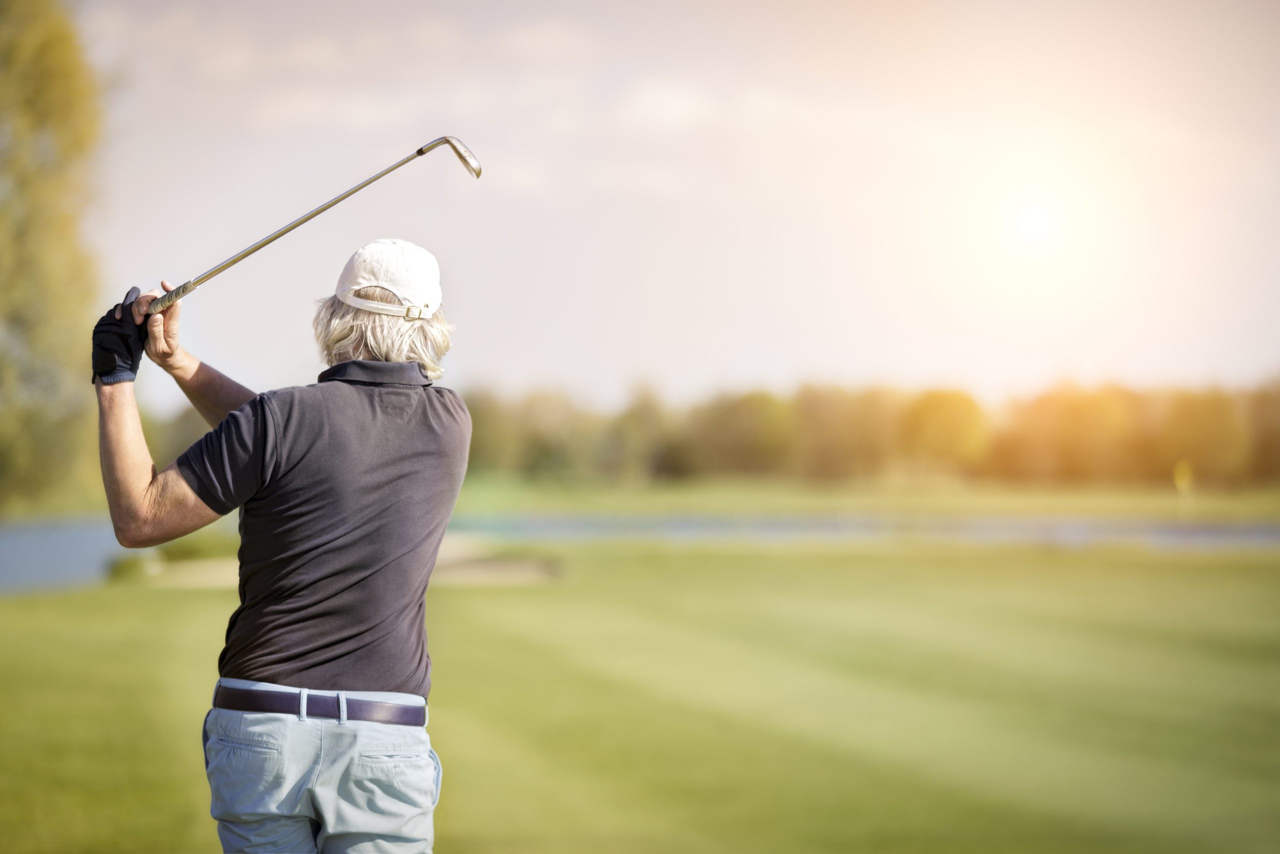 Older man playing golf