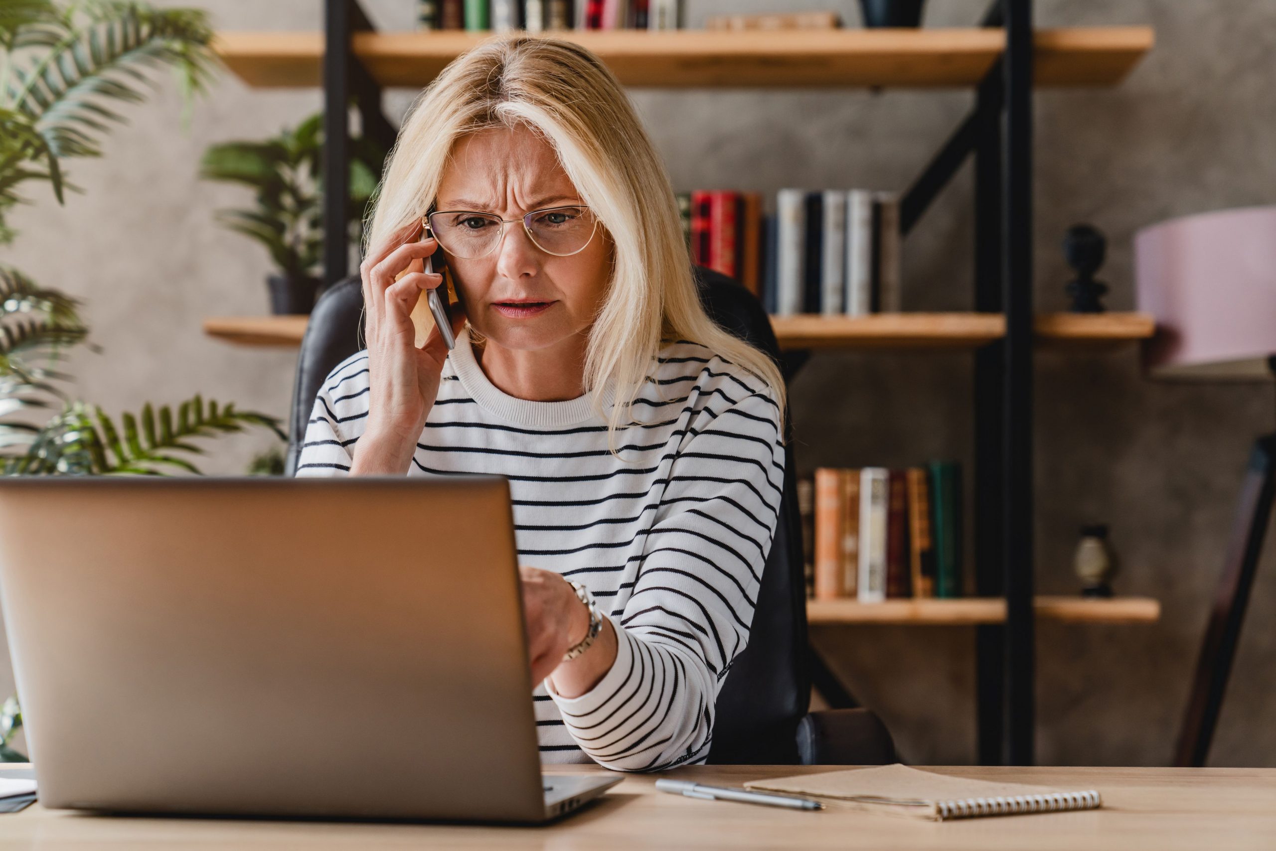 Woman at computer dealing with Chronic Stress