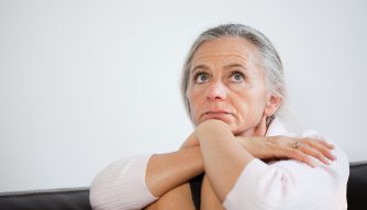 Mature woman looking anxious