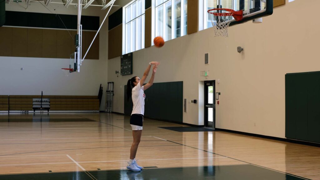 Caroline Ducharme shooting basketball in a gym in The Villages, Florida.