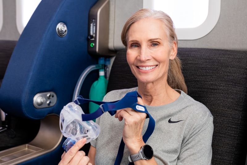 Woman in Hyperbaric Suite Holding Oxygen Mask Aviv Clinics