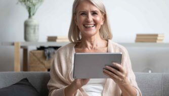 healthy aging woman holding tablet computer