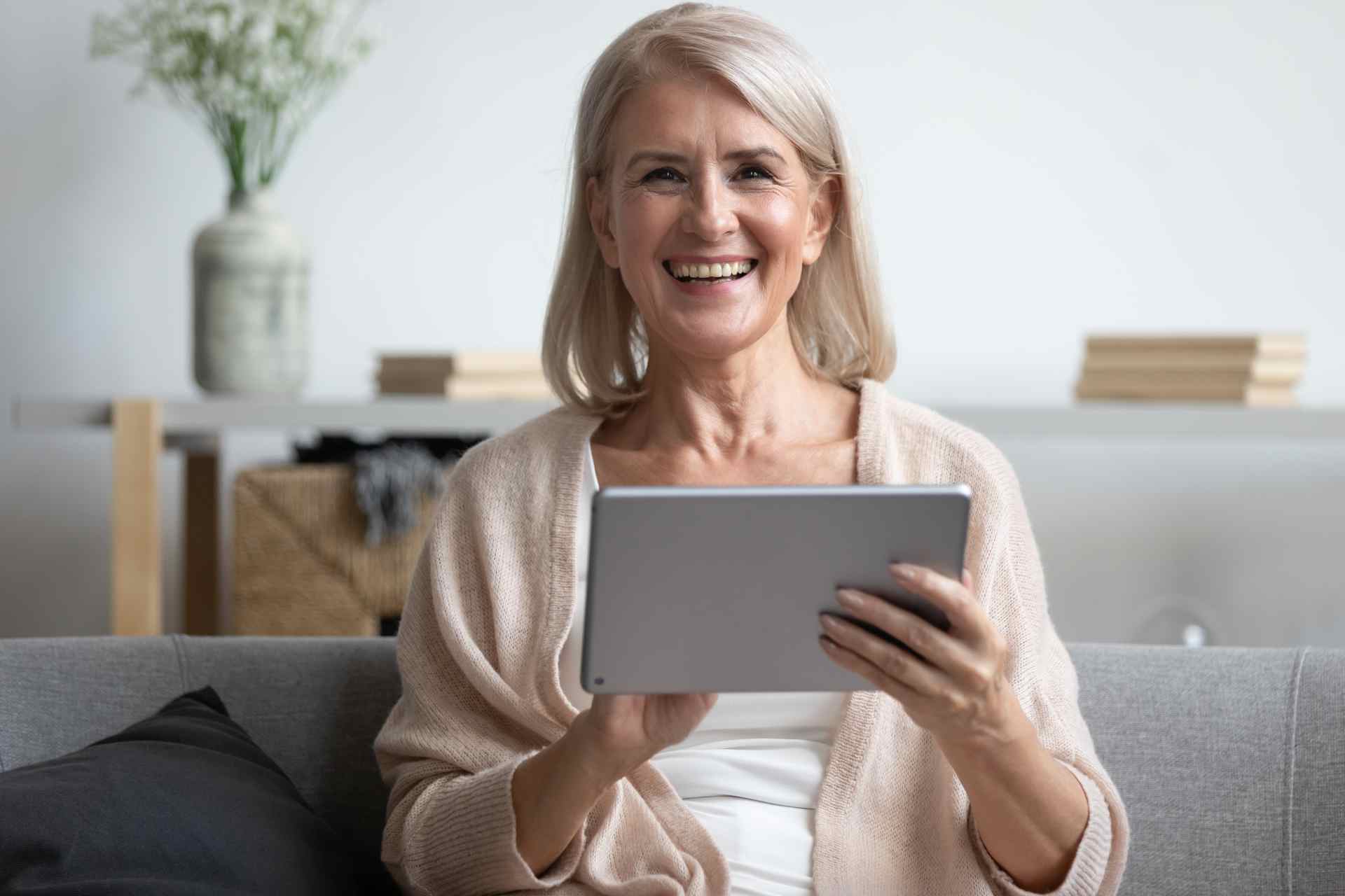 healthy aging woman holding tablet computer
